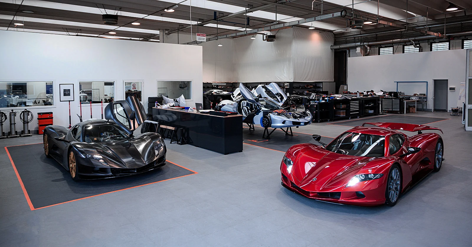 MAT workshop with race cars under development and in the foreground a bright red race car